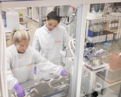 two respiratory scientists using NGI machine