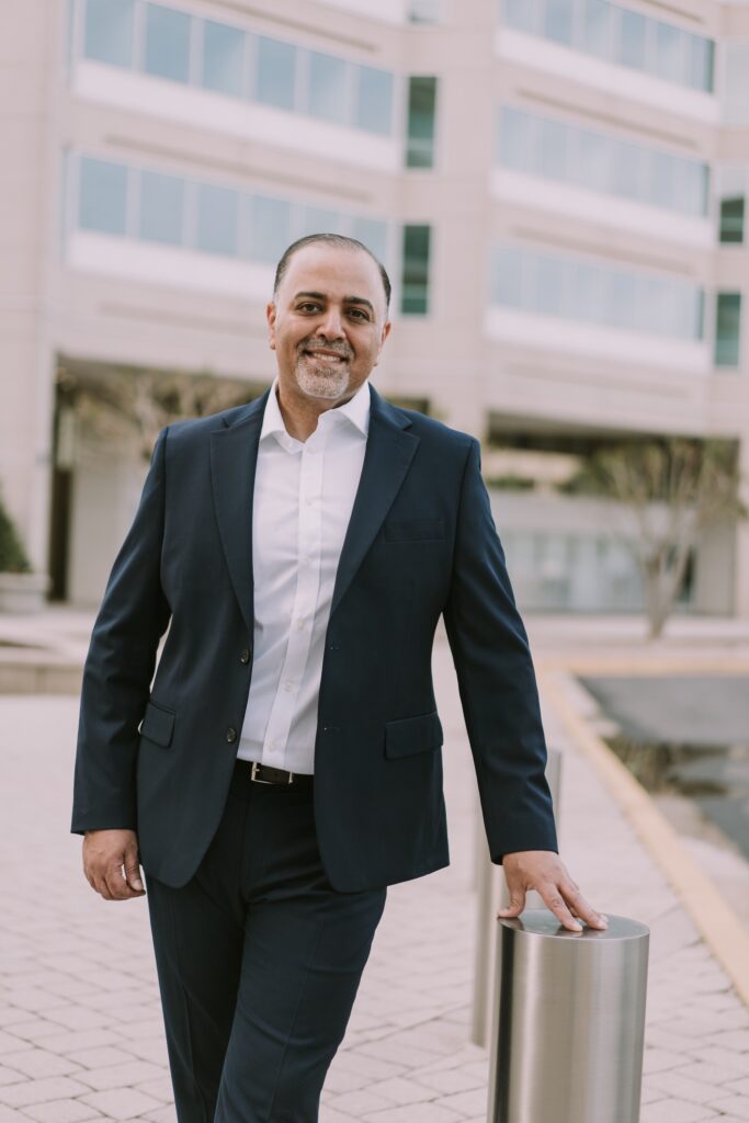 Hesham Abdullah standing in front of the office