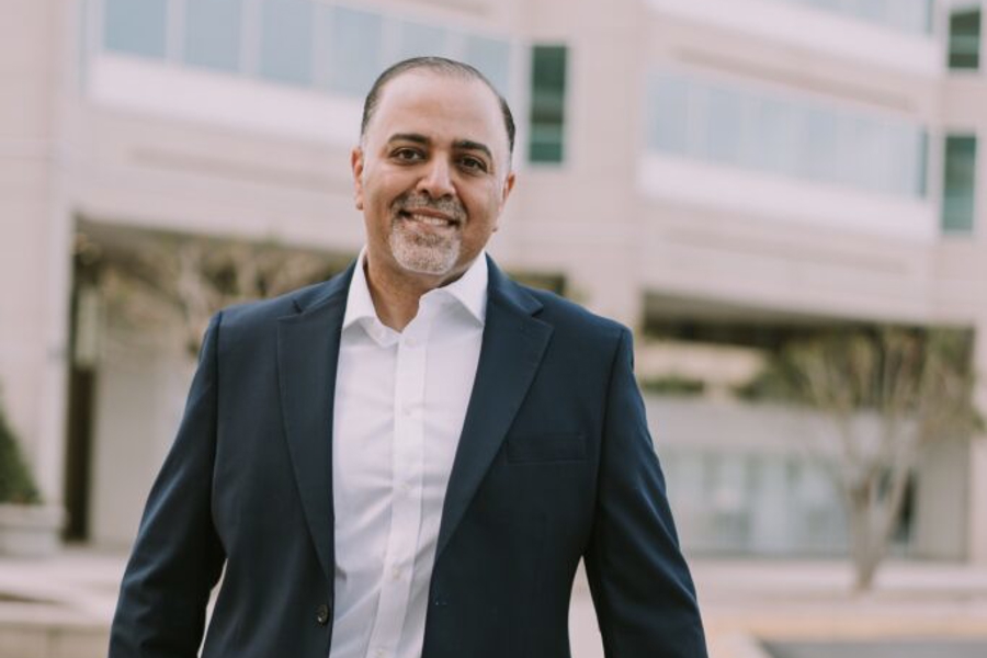 Hesham Abdullah standing in front of the office