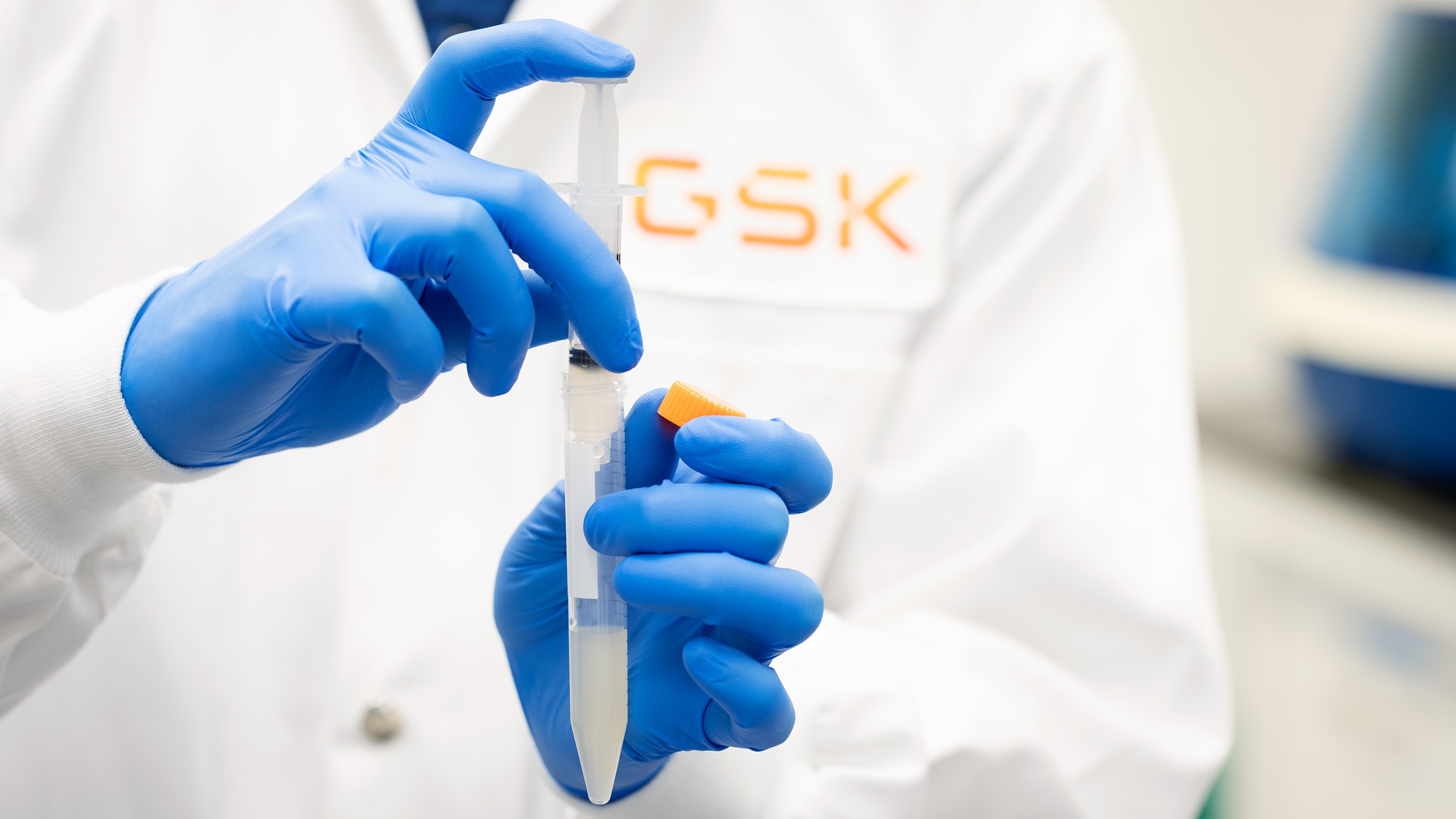 Scientist holding a lab syringe in our Upper Merion R&D site, USA