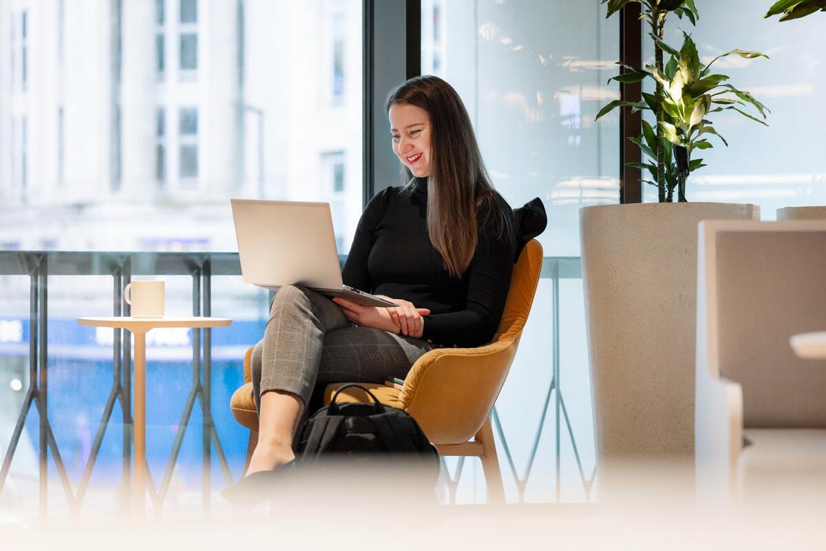 GSK employee sat at laptop