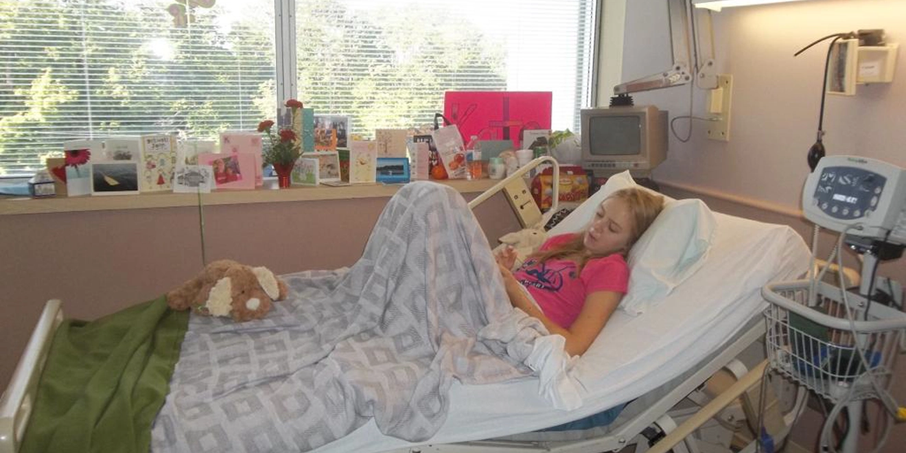Patient Katie in a hospital bed