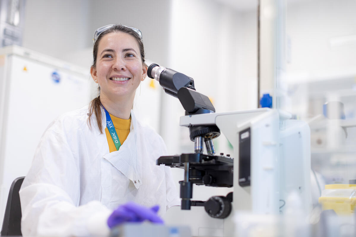 Scientist using a microscope