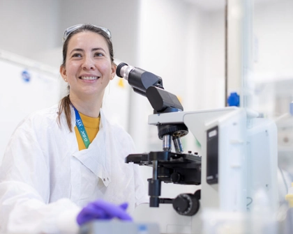 Scientist using a microscope