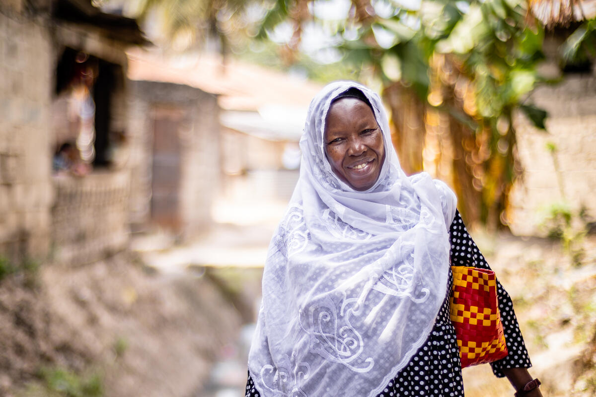 Woman smiling as she walks 