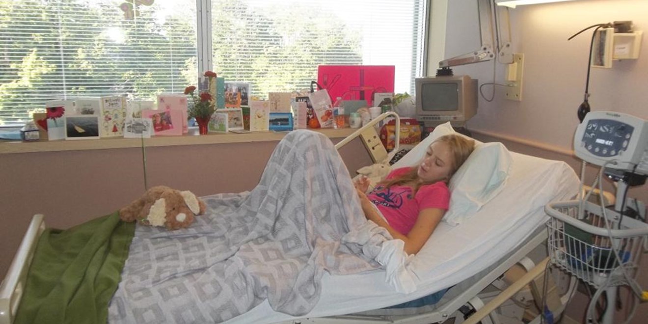 Patient Katie in a hospital bed