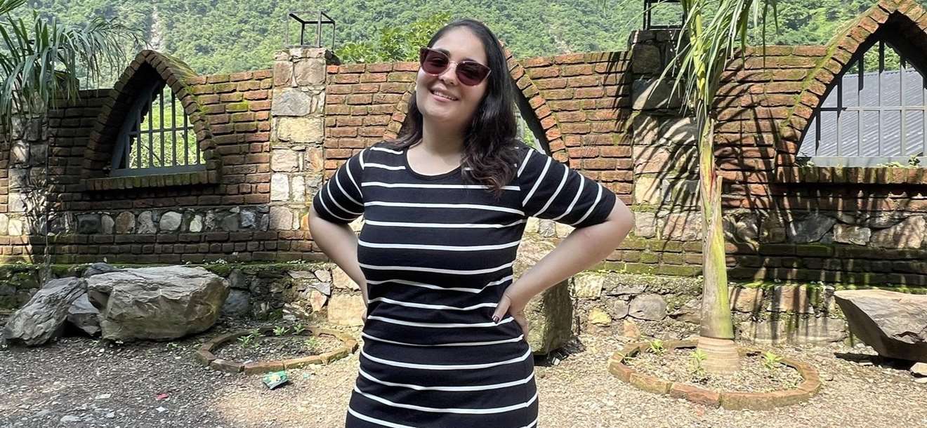 smiling woman in a striped shirt