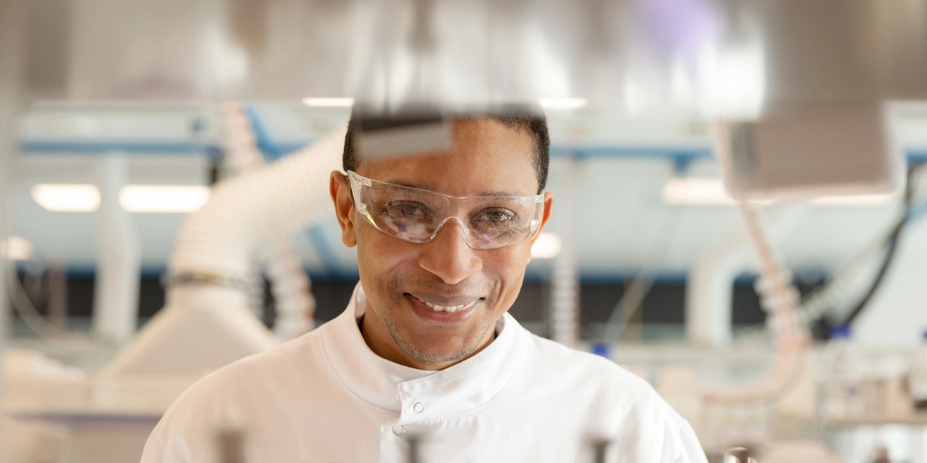 Lab worker smiling