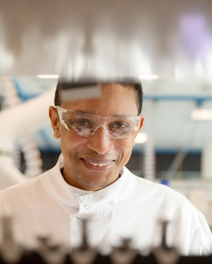Lab worker smiling