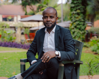 man sitting on chair and posing