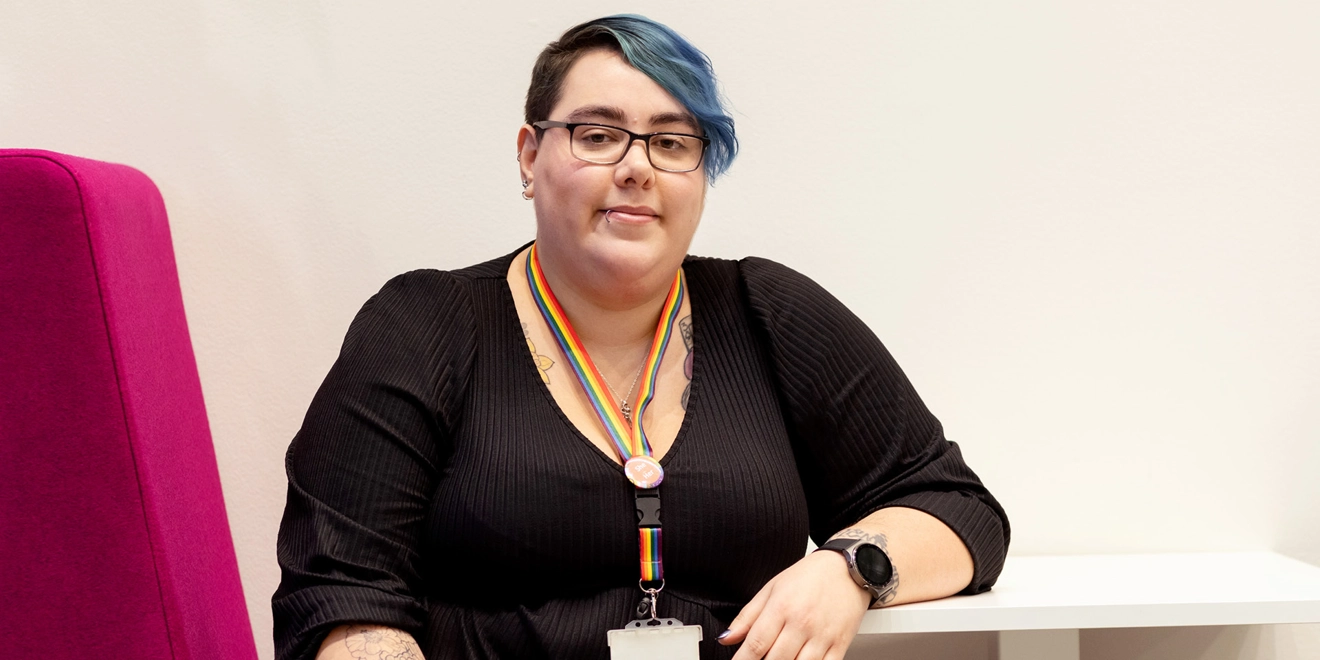 Woman at a table smiling