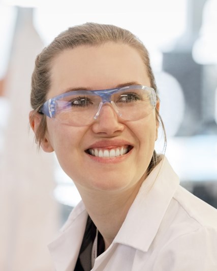 Lab worker smiling
