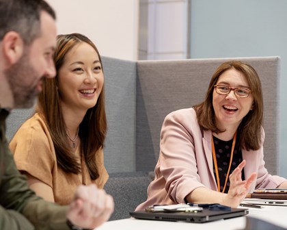 Group of employees laughing