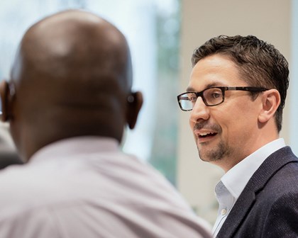 Two men talking joyfully