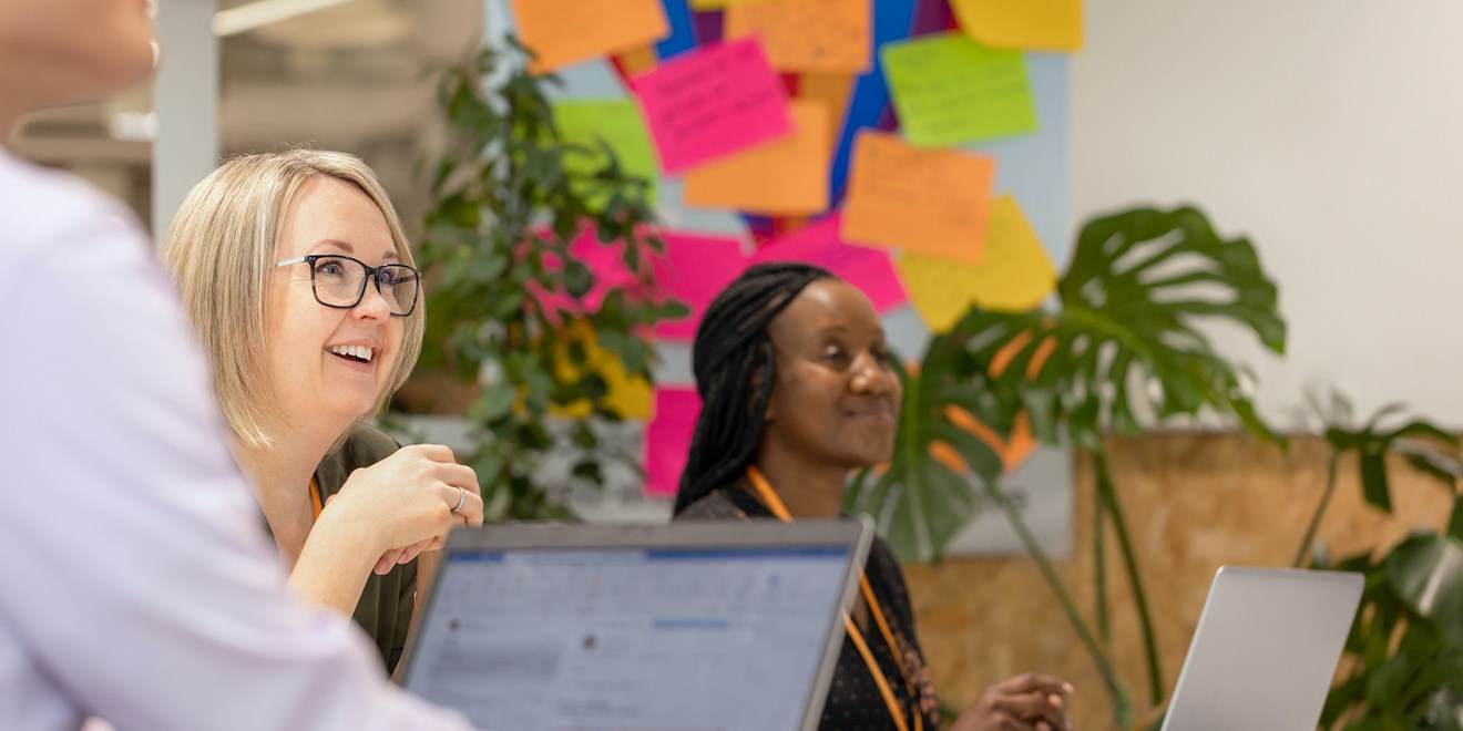 Employees smiling in a meeting