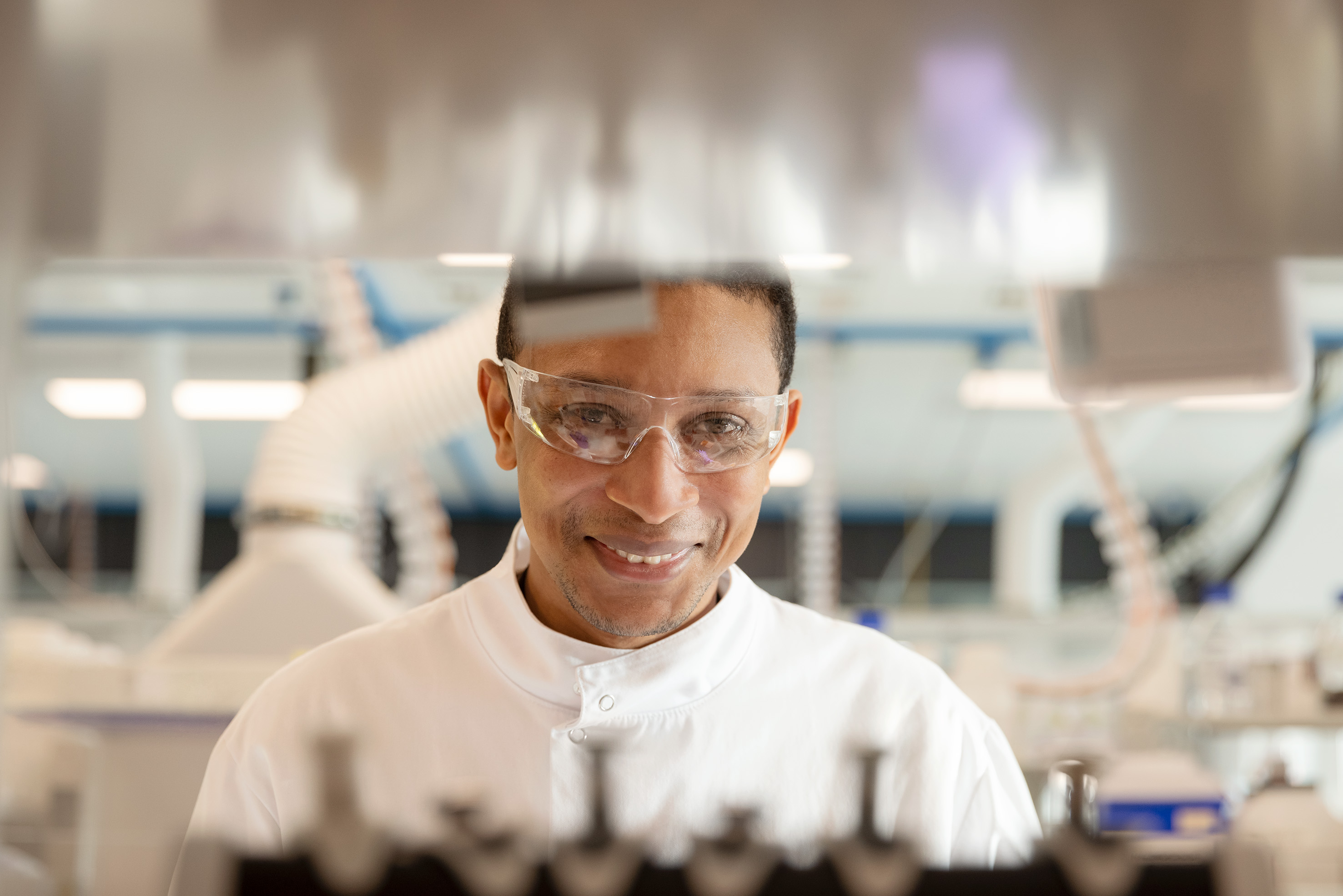 Lab worker smiling