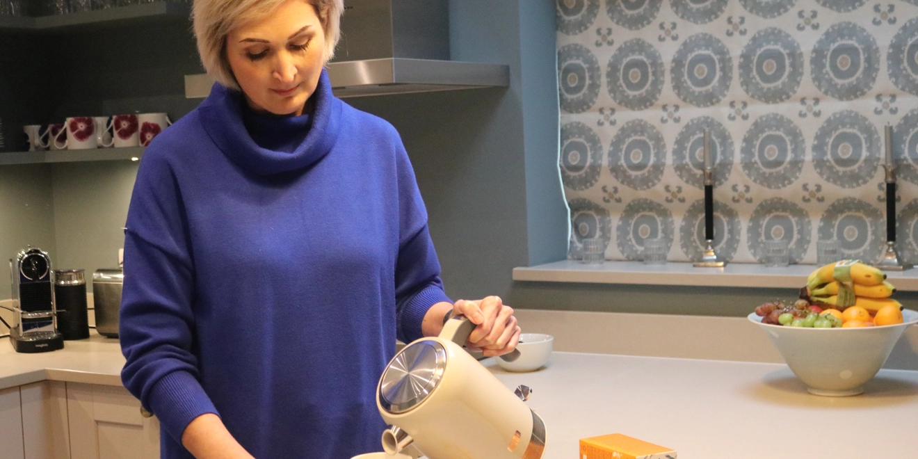 Patient pours kettle into mug