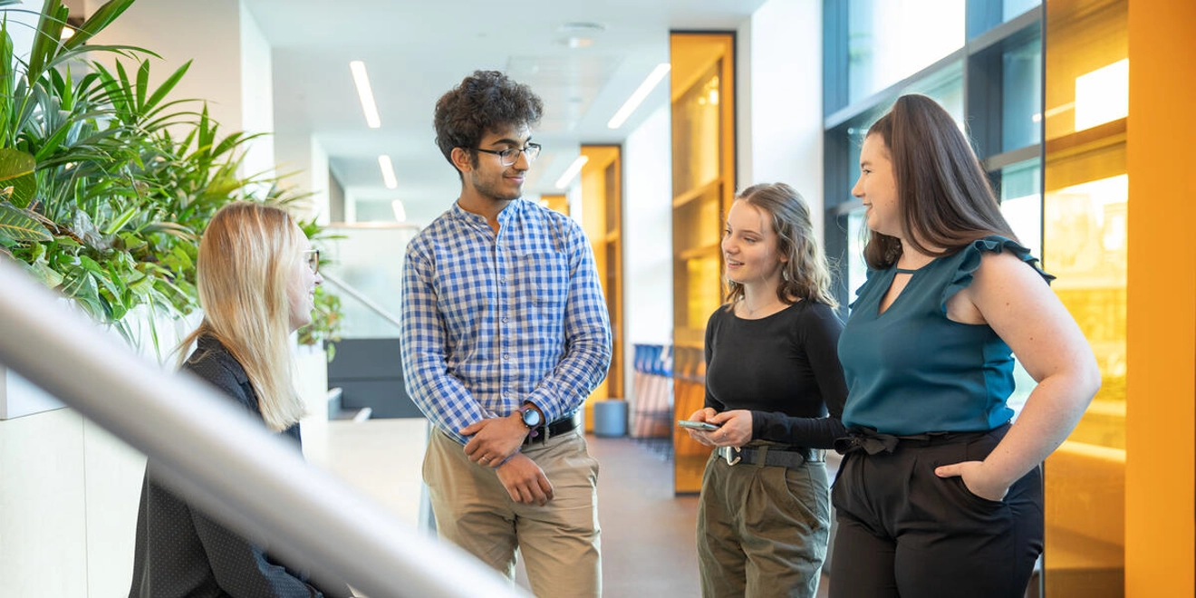 Early Talent Four People Talking