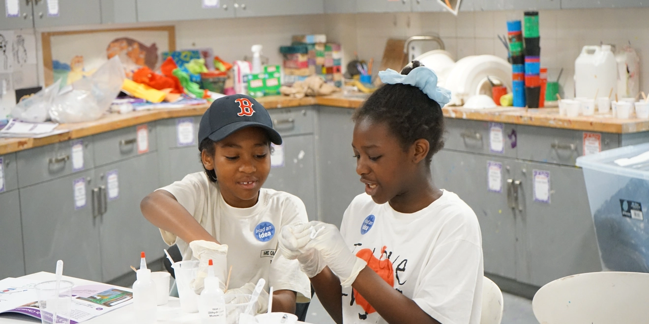 Two children pipetting