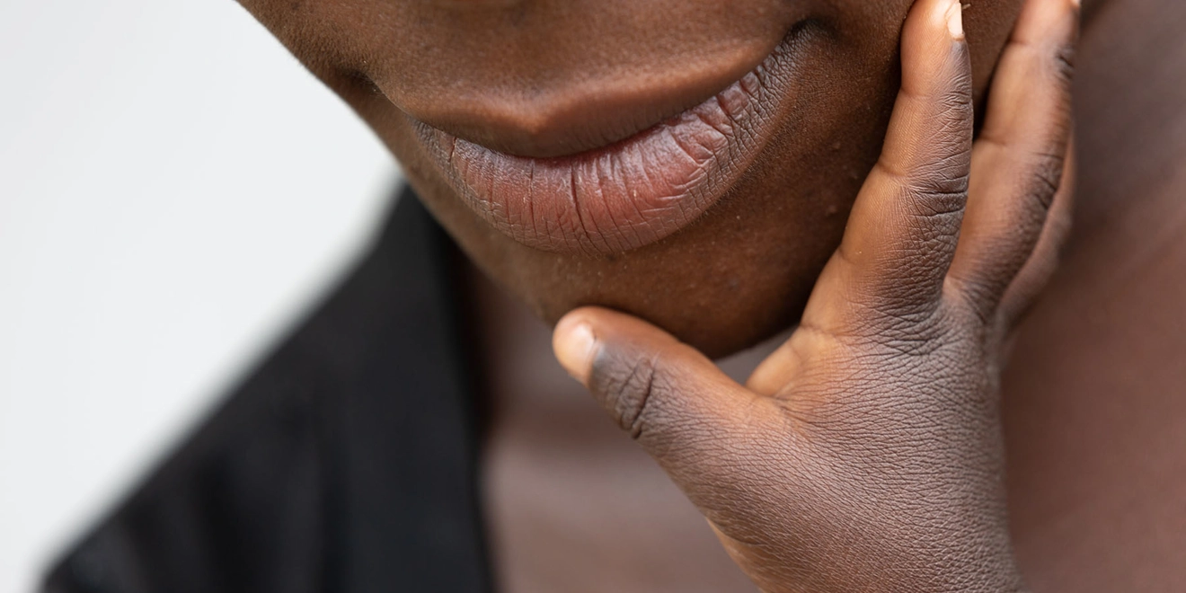 baby touching mothers face