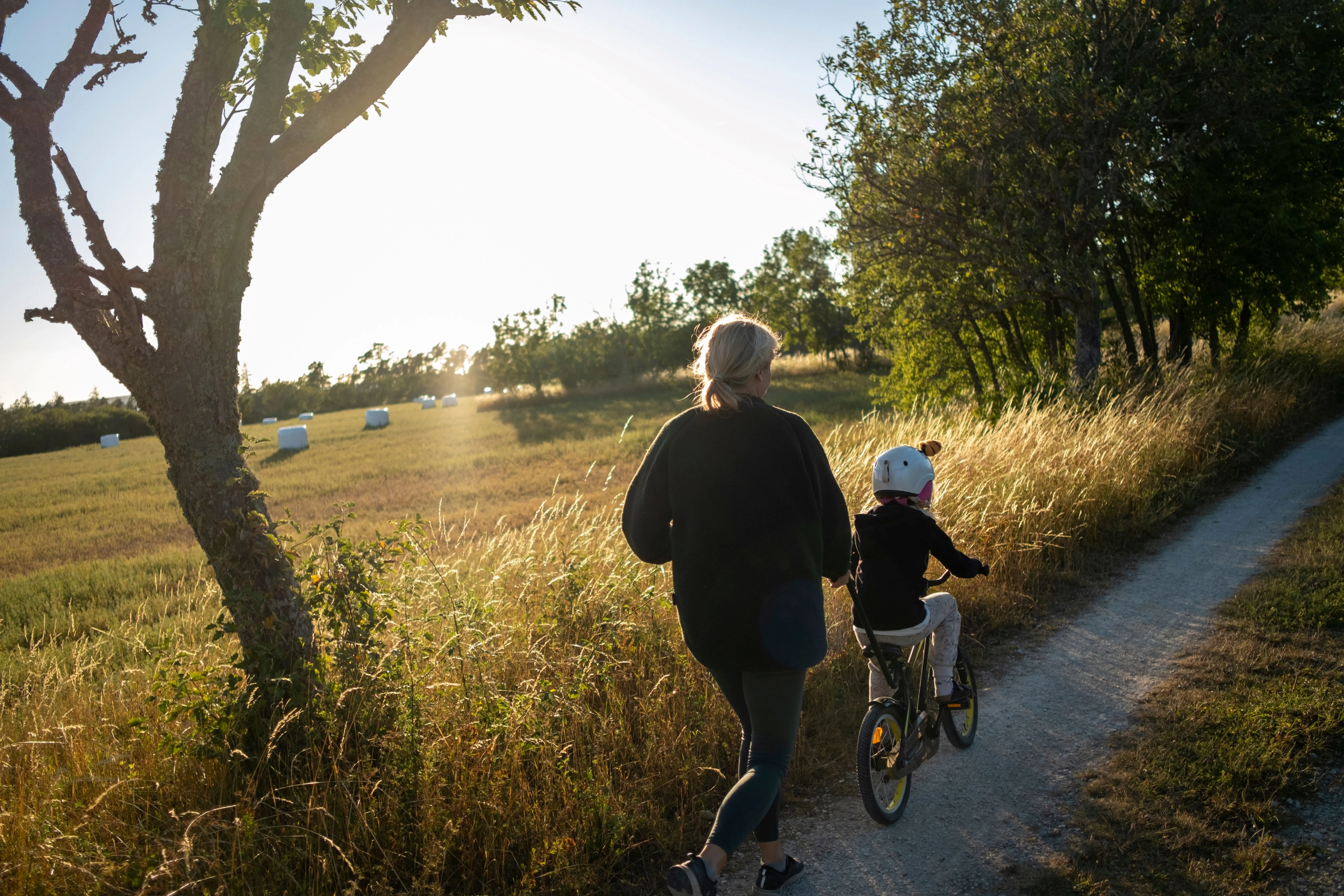 Woman and child riding a bike