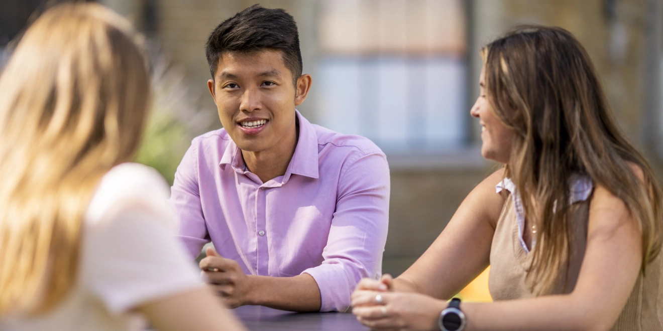 team members talking outside