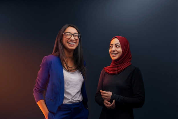 Two people smiling