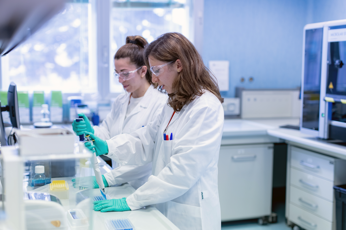 Scientists use pipettes in laboratory