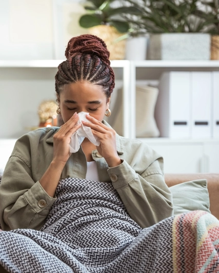 woman sneezing