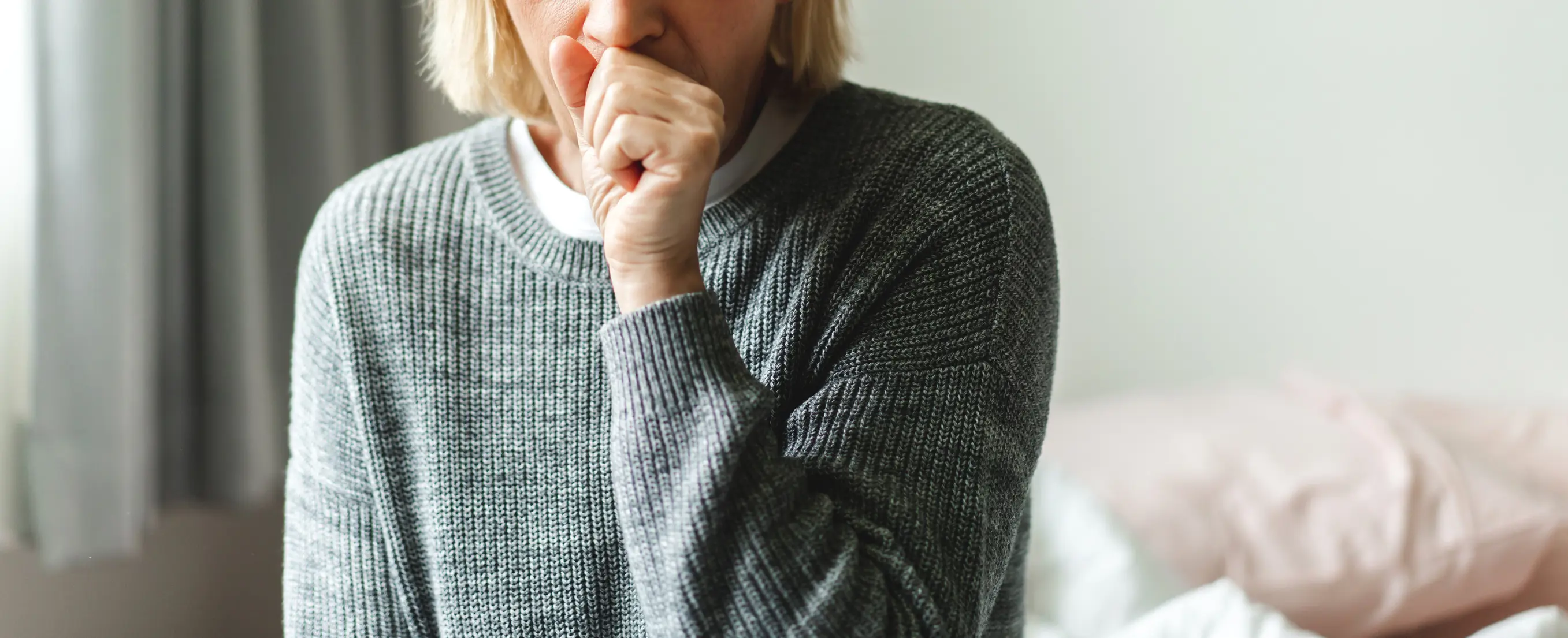 Person coughs in bedroom
