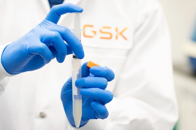 Scientist holding a lab syringe in our Upper Merion R&D site, USA