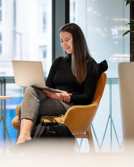 GSK employee sat at laptop