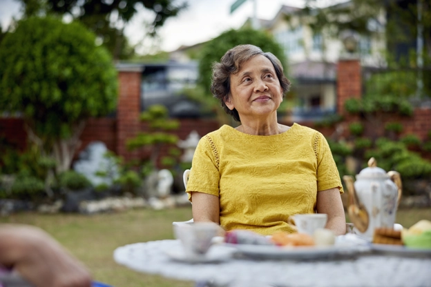 Older patient sitting In garden